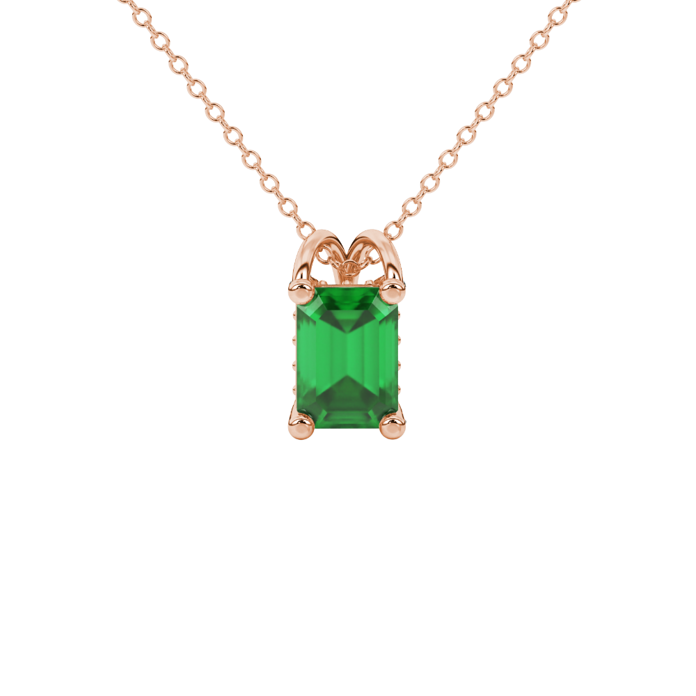Emerald cut green gemstone solitaire pendant in yellow gold four prong setting