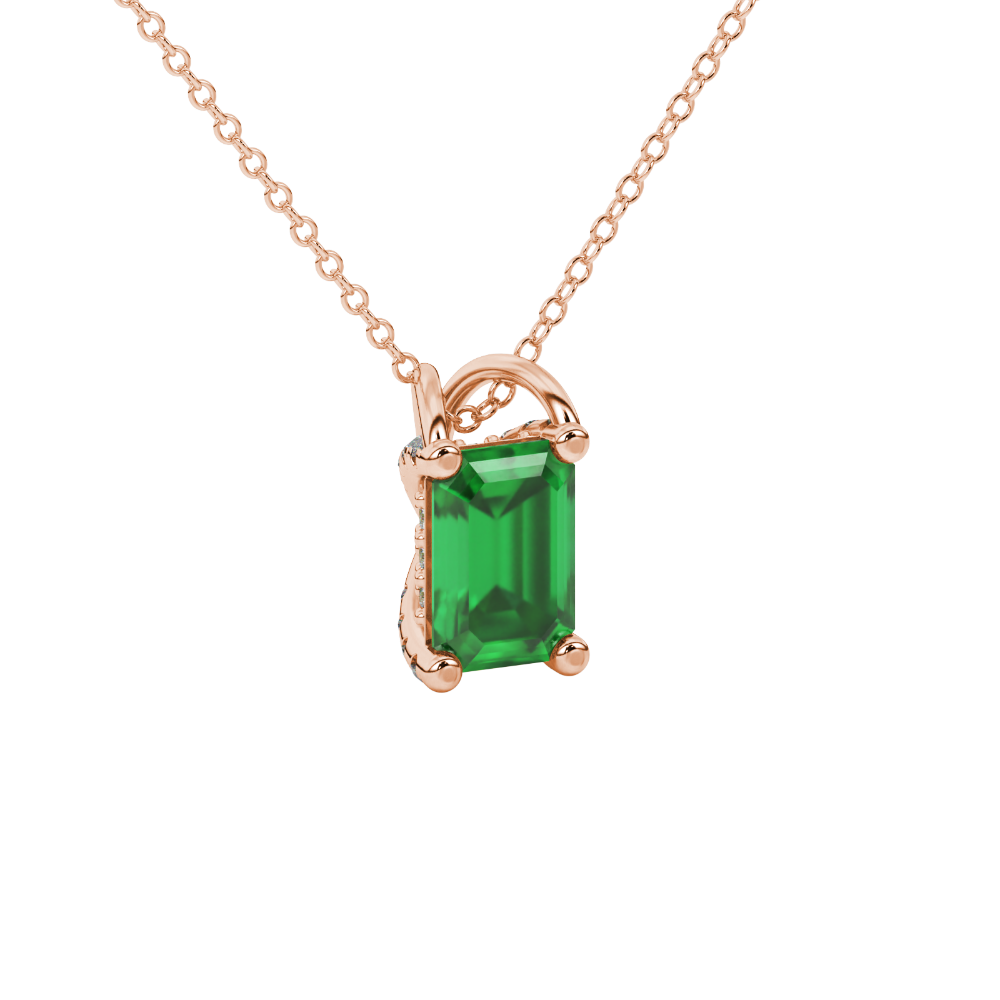 Emerald cut green gemstone solitaire pendant in yellow gold four prong setting