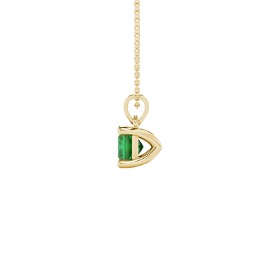 Side profile, yellow gold emerald green pendant, classic basket gallery.