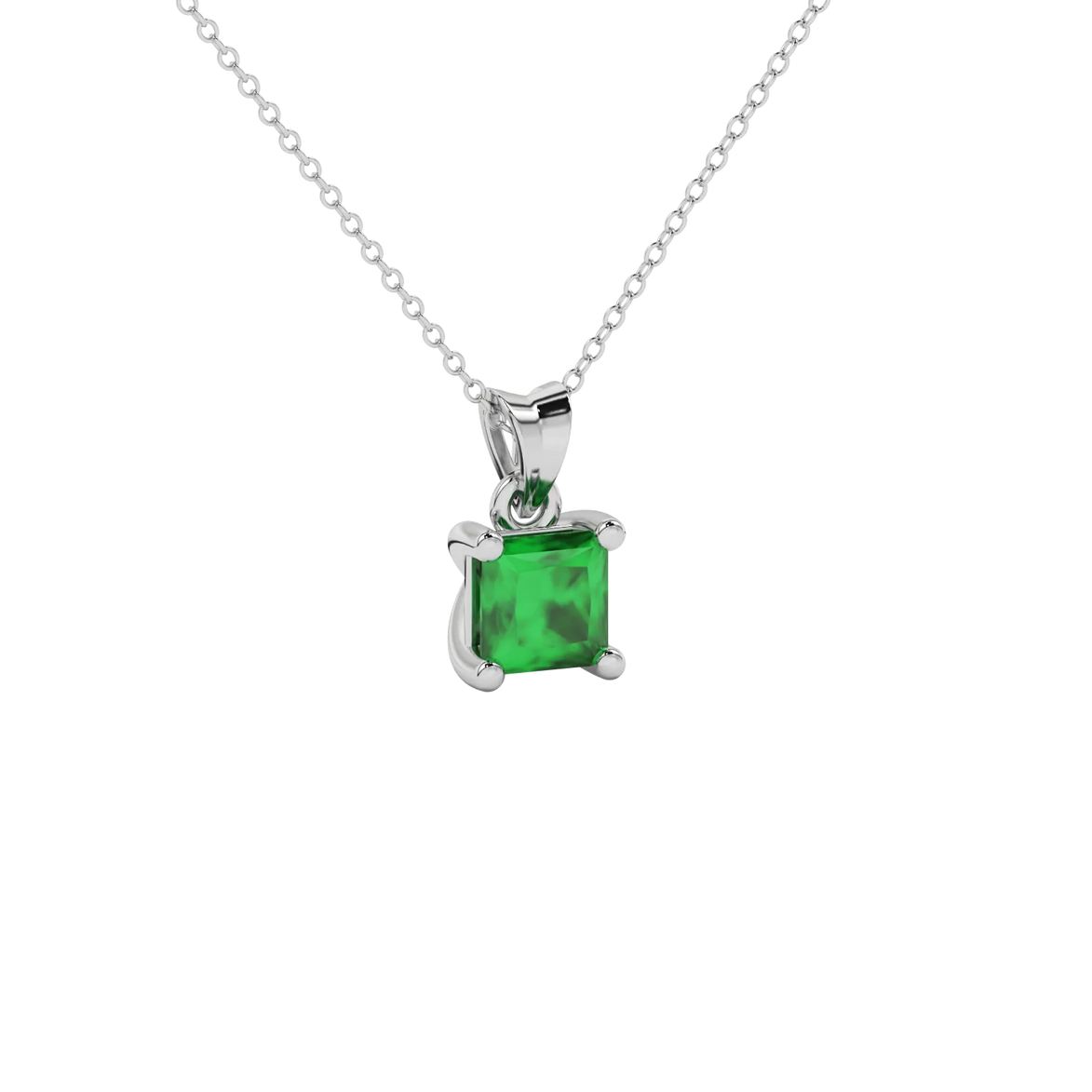 Close-up emerald green gemstone pendant, white gold basket setting.
