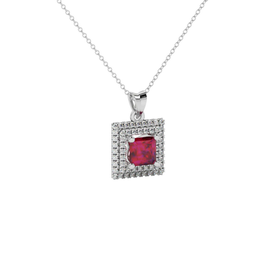 Close-up details of a princess-cut raspberry red gemstone secured in a white gold diamond falling edge halo pendant