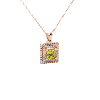 close-up shot of a princess-cut canary yellow gemstone pendant with a rose gold falling edge diamond halo.