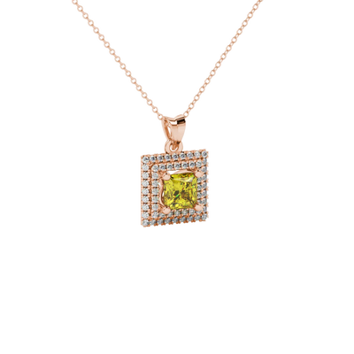 close-up shot of a princess-cut canary yellow gemstone pendant with a rose gold falling edge diamond halo.
