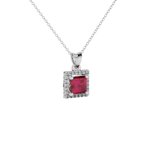 Close-up raspberry red gemstone, Pendant white gold pavé halo.