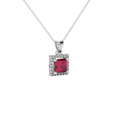 Close-up raspberry red gemstone, Pendant white gold pavé halo.