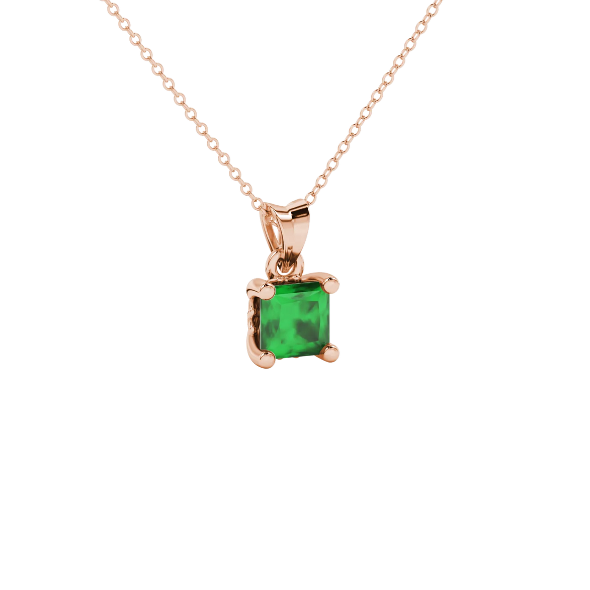 Close-up, princess emerald green gemstone pendant, rose gold lotus setting.