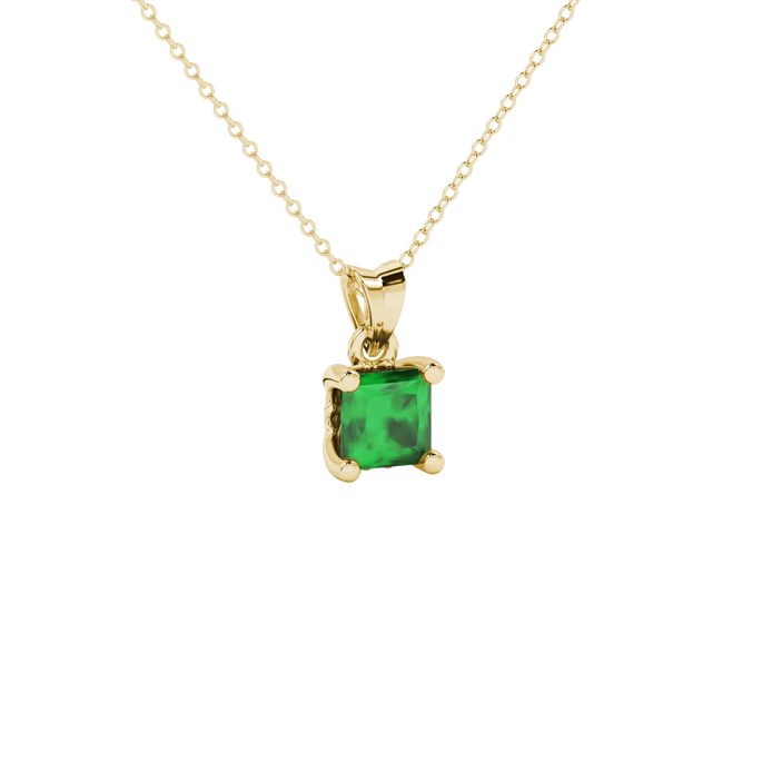 Close-up, princess emerald green gemstone, yellow gold lotus pendant.