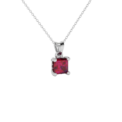 Close-up raspberry red gemstone, white gold lotus setting.