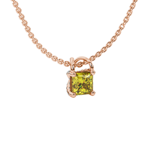 Close-up, princess canary yellow gemstone pendant, rose gold basket setting.