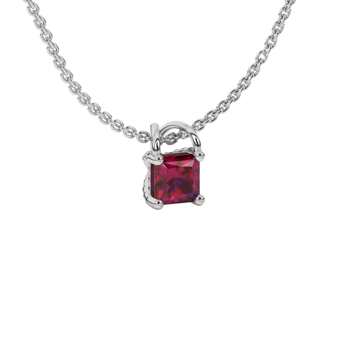 Close-up raspberry red gemstone, white gold basket setting.