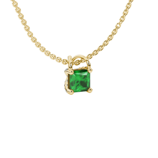 Close-up, princess emerald green gemstone, yellow gold basket pendant.
