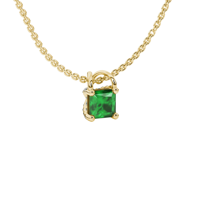 Close-up, princess emerald green gemstone, yellow gold basket pendant.