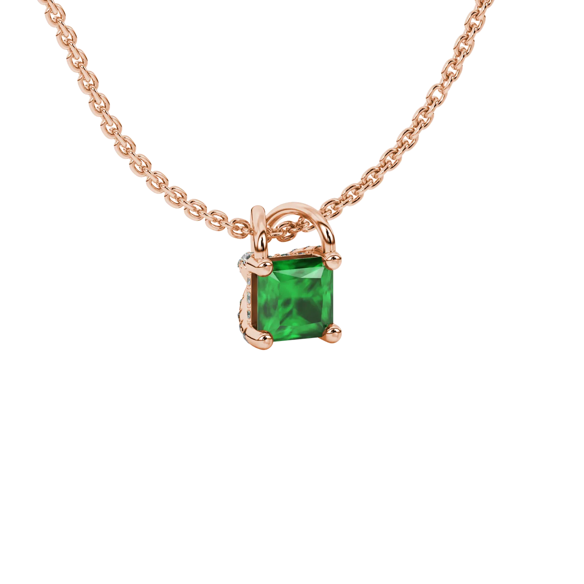 Close-up, princess emerald green gemstone pendant, rose gold basket setting.