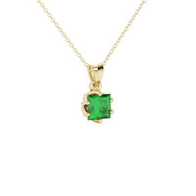 Close-up, princess emerald green gemstone, yellow gold scalloped pendant.