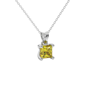 Close-up canary yellow gemstone pendant, white gold surprise setting.