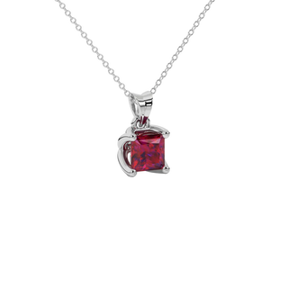 Close-up raspberry red gemstone pendant white gold tulip setting.