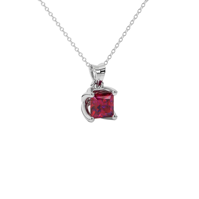 Close-up raspberry red gemstone pendant white gold tulip setting.