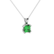 Close-up emerald green gemstone pendant, white gold vintage setting.