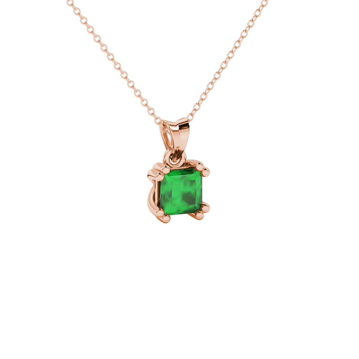 Close-up, princess emerald green gemstone pendant, rose gold vintage setting.