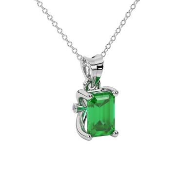 emerald green gemstone solitaire pendant in white gold