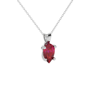 Close-up raspberry red gemstone, white gold four-prong setting.