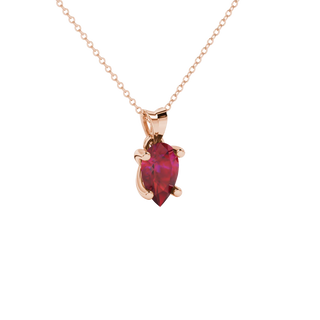 Close-up, pear shape raspberry red gemstone pendant, rose gold four-prong setting.