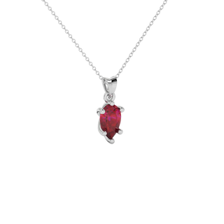 Close-up raspberry red gemstone, white gold six-prong setting.