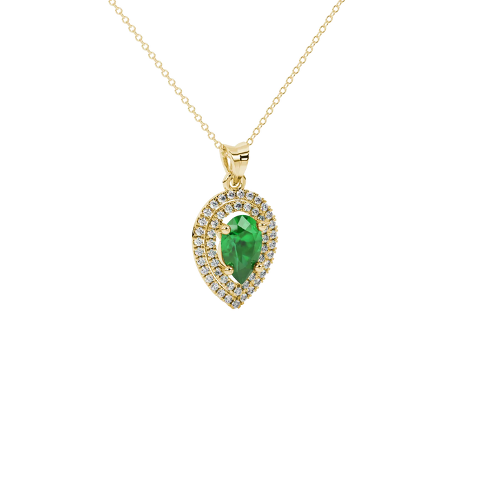 Close-up, pear shape emerald green gemstone, yellow gold halo pendant.