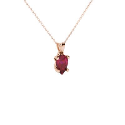 Close-up, pear shape raspberry red gemstone pendant, rose gold lotus basket.