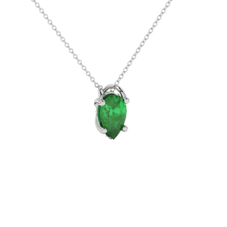 Close-up emerald green gemstone, white gold pavé basket.