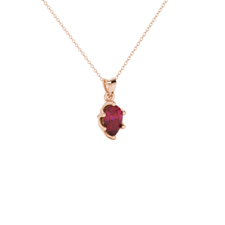 Close-up, pear shape raspberry red gemstone pendant, rose gold scalloped setting.