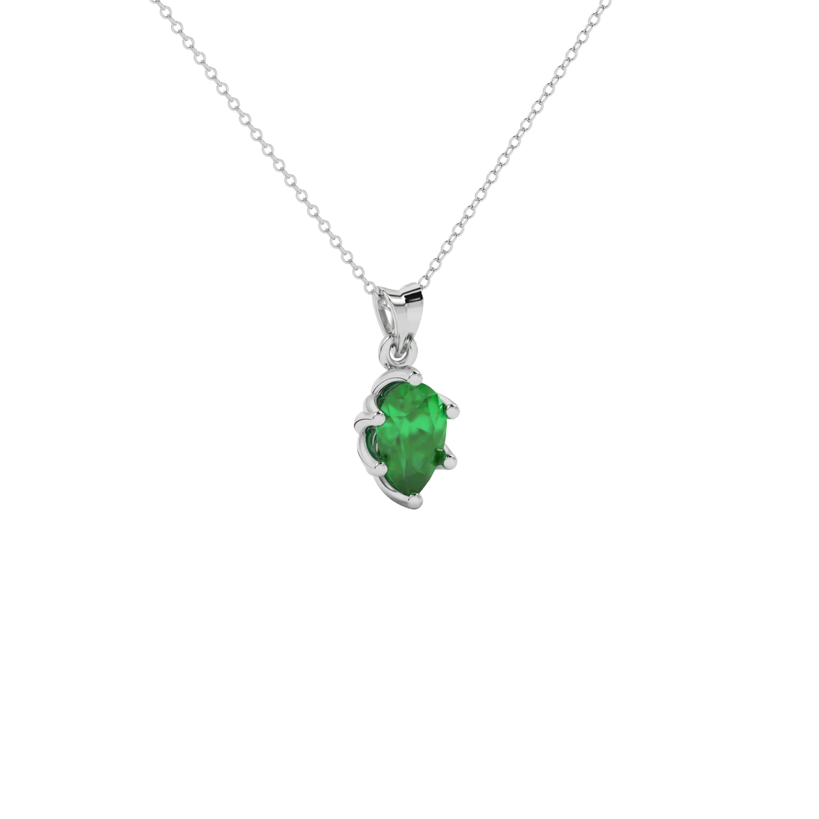 Close-up emerald green gemstone, white gold scalloped setting.
