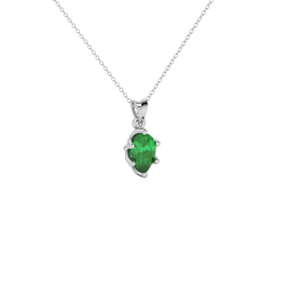 Close-up emerald green gemstone, white gold scalloped setting.