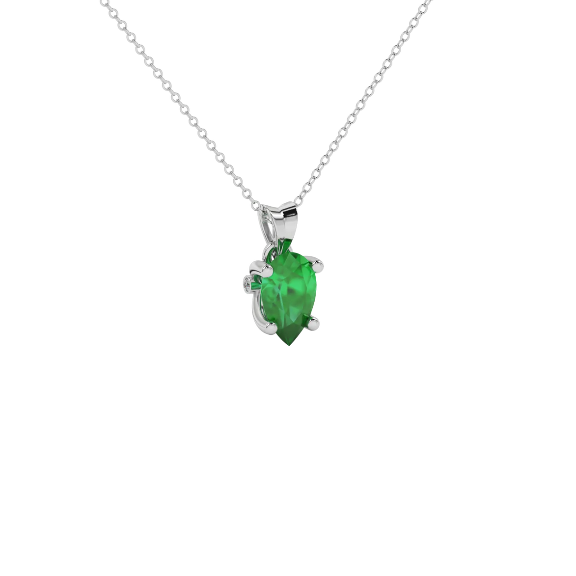 Close-up emerald green gemstone pendant, white gold surprise diamond setting.