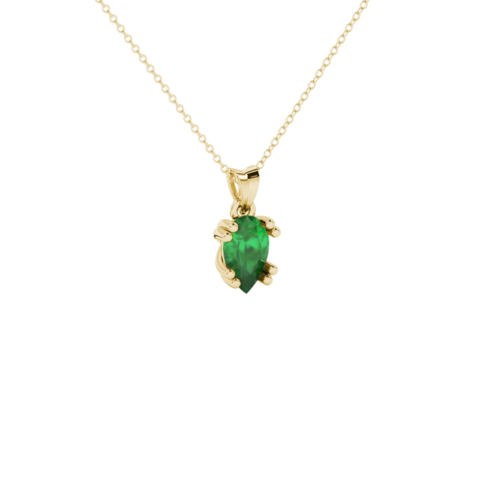 Close-up, pear shape emerald green gemstone, yellow gold vintage basket pendant.