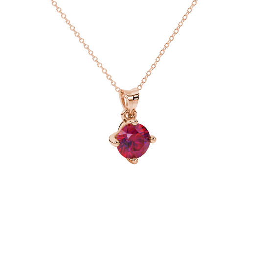 close-up shot of a round raspberry red gemstone pendant with a rose gold four-prong design.