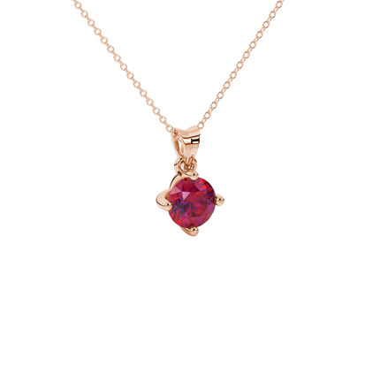 close-up shot of a round raspberry red gemstone pendant with a rose gold four-prong design.