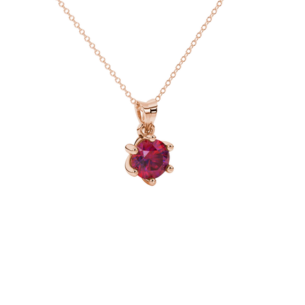 close-up shot of a round raspberry red gemstone pendant with a rose gold six-prong design.