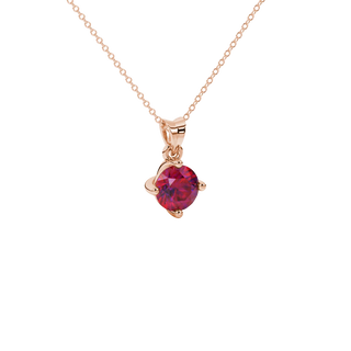 close-up shot of a round raspberry red gemstone pendant with a rose gold classic basket design.