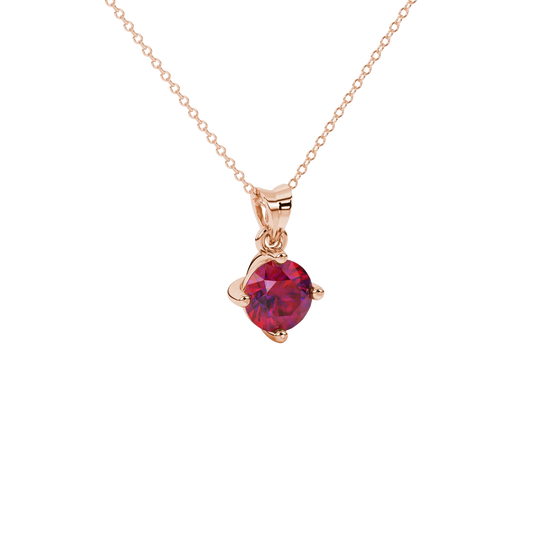 close-up shot of a round raspberry red gemstone pendant with a rose gold classic basket design.