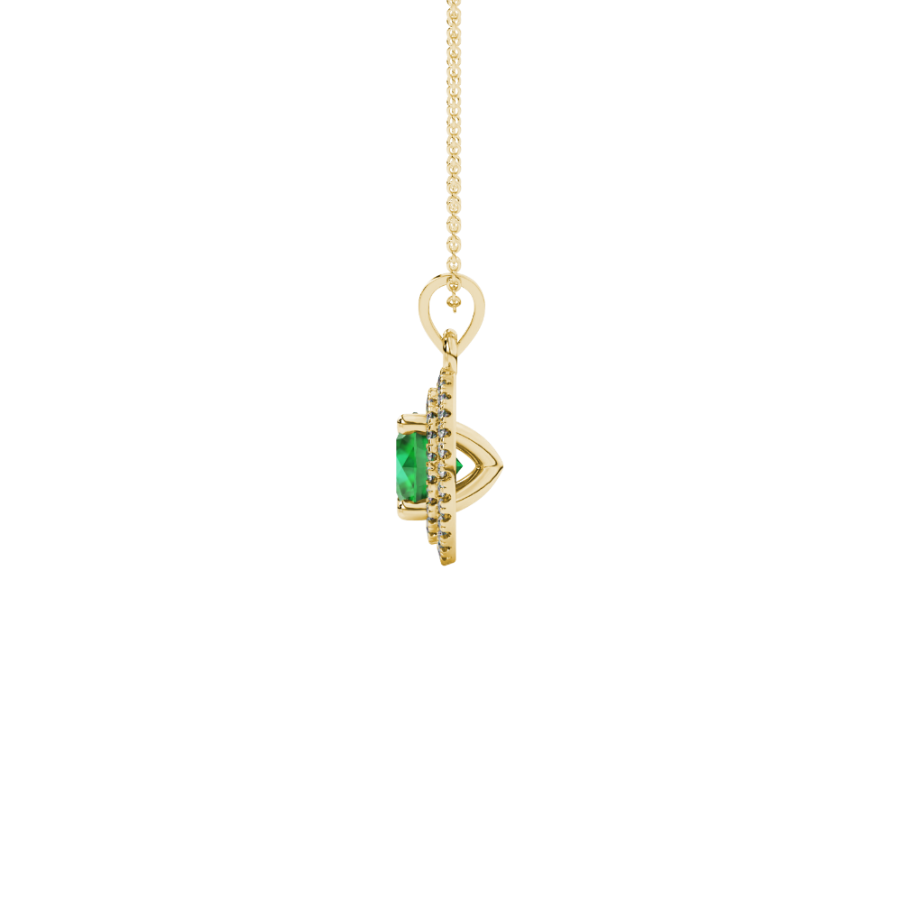 Side profile of a yellow gold emerald green gemstone pendant with a falling edge halo design.