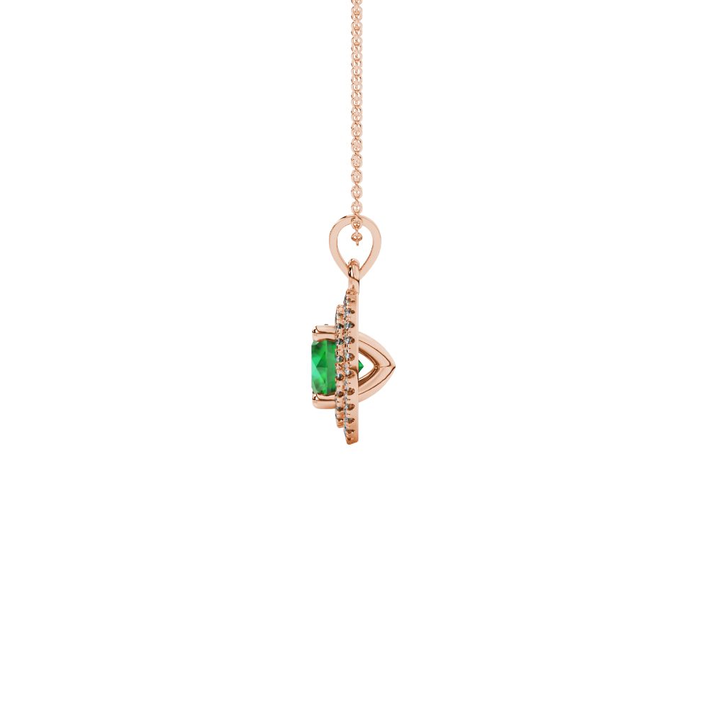 Side angle of a rose gold emerald green gemstone pendant showcasing the falling edge halo gallery.