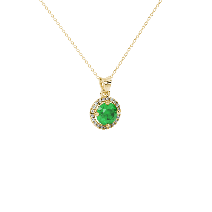 Close-up details of a round-cut emerald green gemstone in a yellow gold diamond French pavé halo pendant.