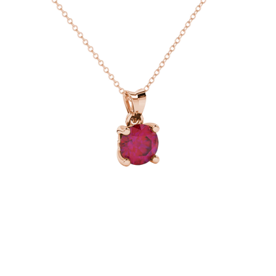 Close-up shot of a round raspberry red gemstone pendant with a rose gold lotus basket design.