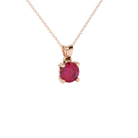 Close-up shot of a round raspberry red gemstone pendant with a rose gold lotus basket design.