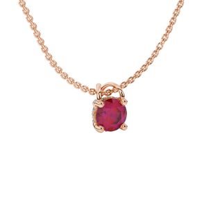 close-up shot of a round raspberry red gemstone pendant with a diamond pavé basket in rose gold.