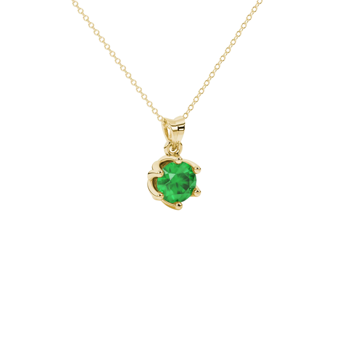 Close-up details of a round-cut emerald green gemstone in a yellow gold scalloped six-prong pendant.
