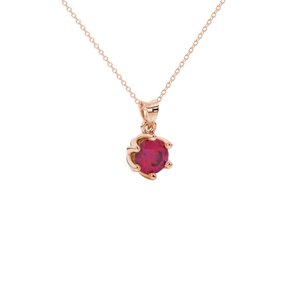 close-up shot of a round raspberry red gemstone pendant with a rose gold scalloped six-prong design.