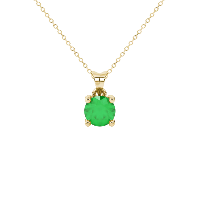 Round-cut emerald green gemstone pendant in a yellow gold surprise diamond setting
