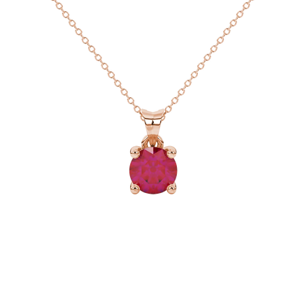 Round-cut raspberry red gemstone pendant in a rose gold surprise diamond setting.